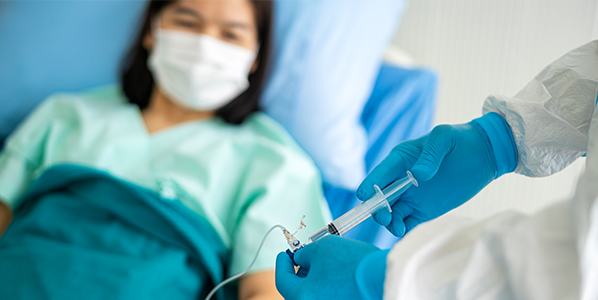 Woman getting medicine through an IV